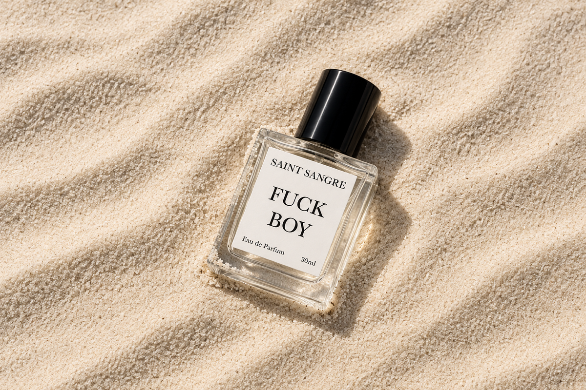 Full-size Fuck Boy bottle lying in sand